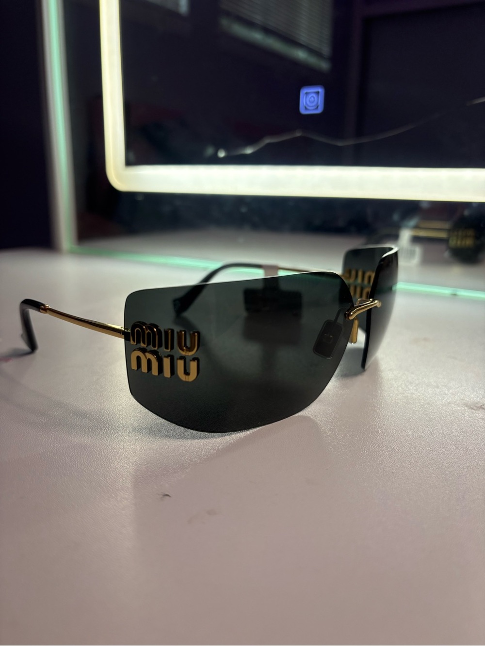 Miu Miu Sunglasses in brown and Gold